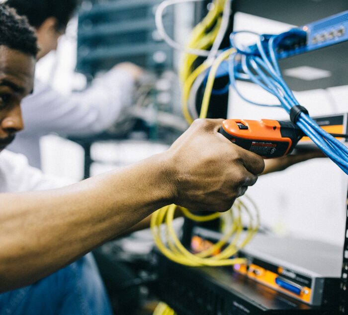 Technician connecting network cabling
